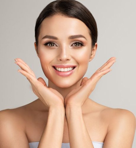 a woman showing off a great smile and flawless skin