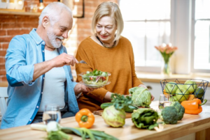 Man and woman making a healthy salad together